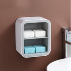 Wall-mounted soap dispenser with soap bars on a brown wall