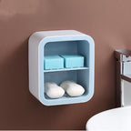 Wall-mounted soap holder with soap bars on a brown wall