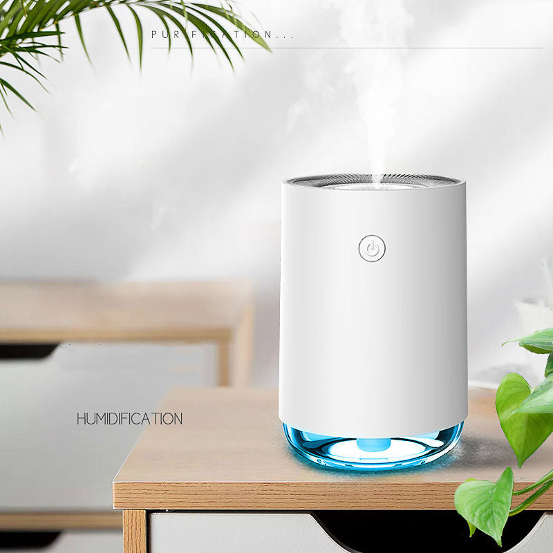 White humidifier with blue base on a wooden table, surrounded by green plants.