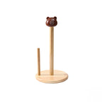 Wooden paper towel holder with bear-shaped top on a white background