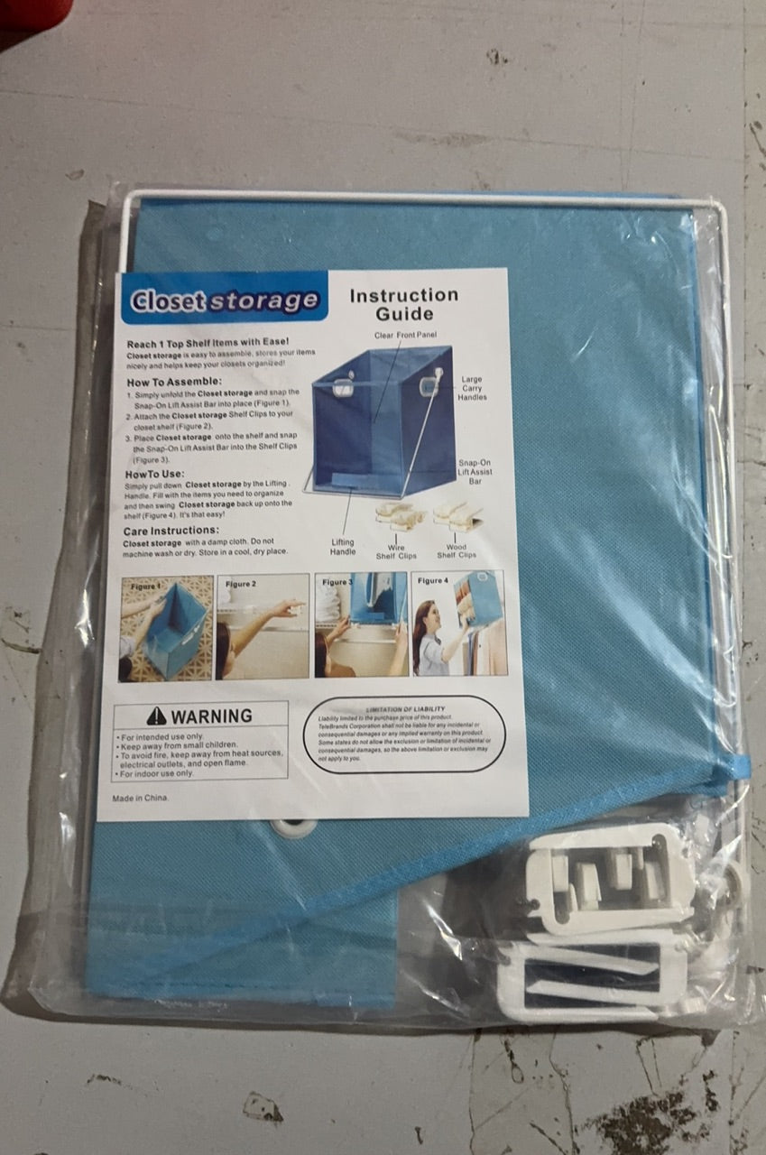 Blue closet storage unit with instruction guide on a white surface