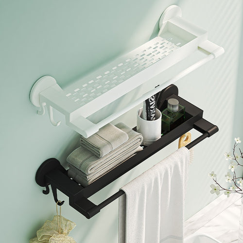 Bathroom shelf with towel bar and hooks against a light green wall.