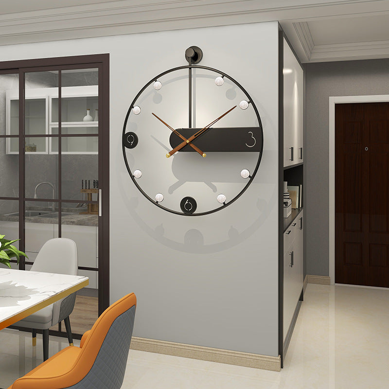 Modern wall clock on a gray wall in a kitchen setting