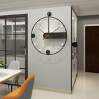 Modern wall clock on a gray wall in a kitchen setting