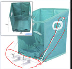 Teal folding chair with measurement inset and parts diagram on a white background