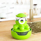 Green kitchen sponge holder with a transparent container on a wooden surface